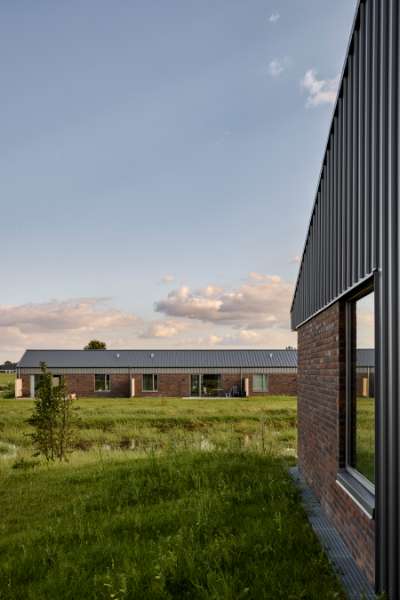 Past and future meet in steel-clad terraced houses with history in the backyard, Jernaldervej 8, 8600 Silkeborg, Denmark